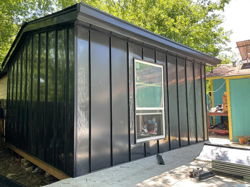 Black standing seam metal wall panels for Roof Inspection in On Top of the World