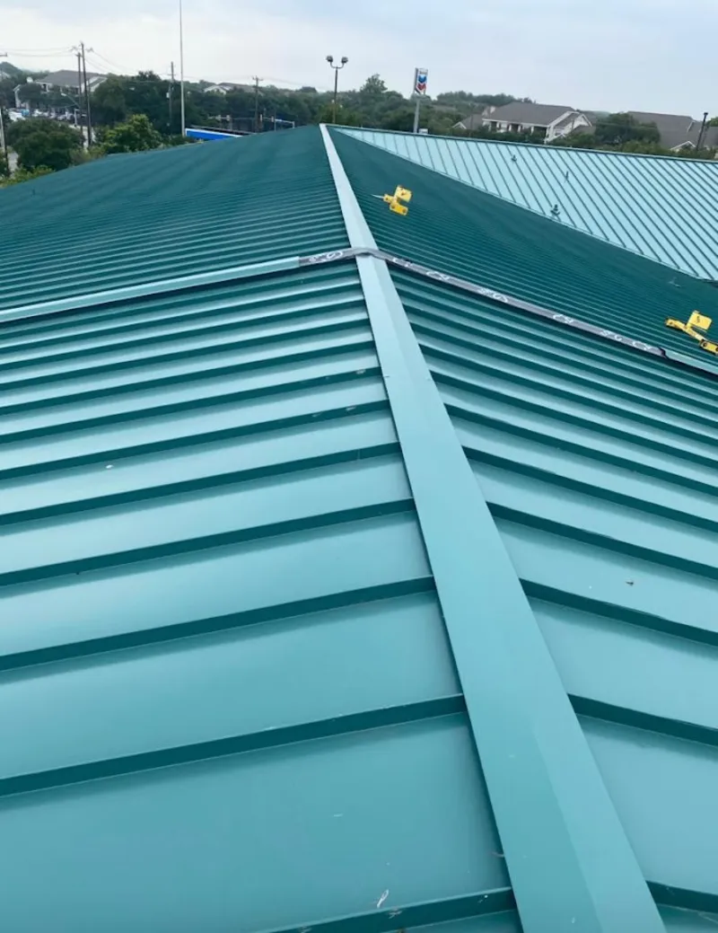 Green commercial metal roof ridge and valley for Metal Roof Repair in On Top of the World